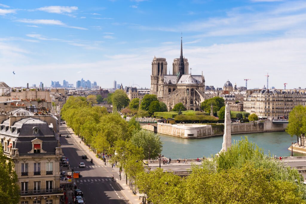 Notre-Dame de Paris: An Eternal Horizon In this photo, Notre-Dame Cathedral stands tall above the serene waters of the Seine, an iconic monument that continues to captivate and inspire after centuries of history.