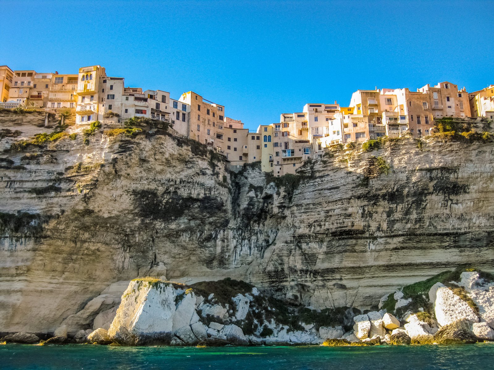 Historic cliffside architecture overlooking the azure waters of the Mediterranean