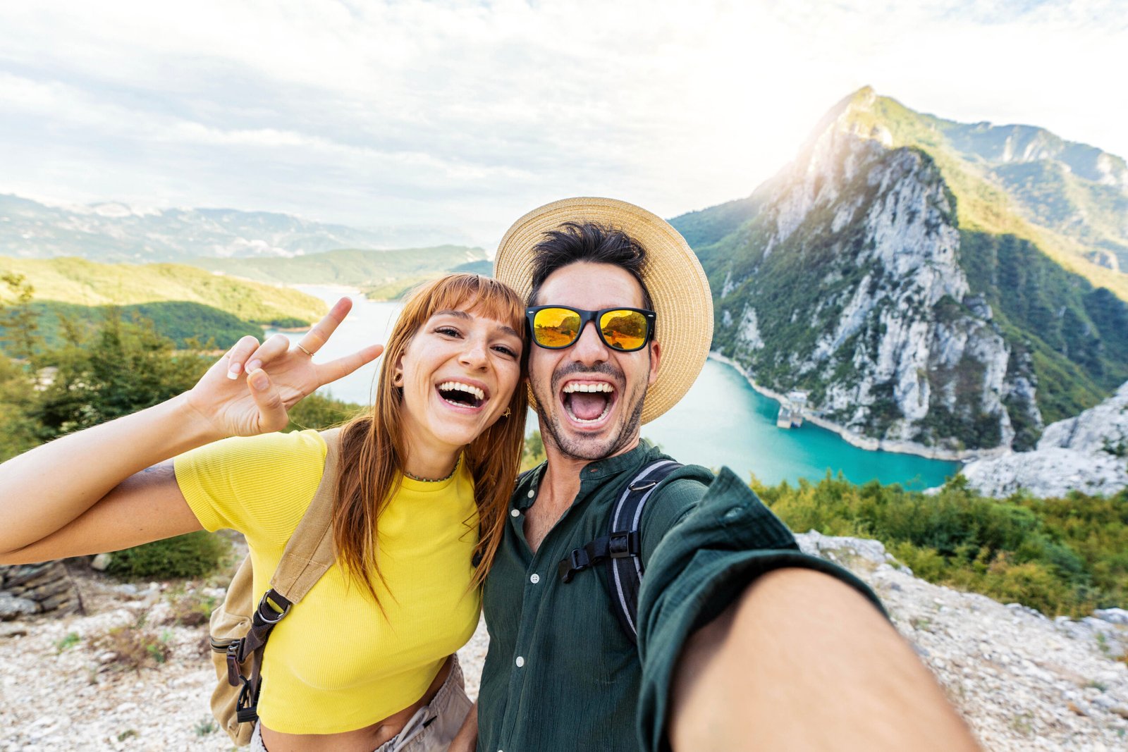 The banner showcases an elated couple set against a backdrop of stunning natural beauty, capturing the spirit of adventure and exploration that awaits with our travel services. Their smiles suggest an array of unforgettable moments that our clients can expect when they embark on a journey with us.